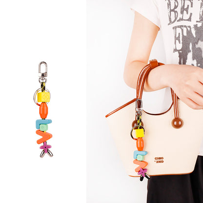 Personalized resin bag jewel for college student tote
