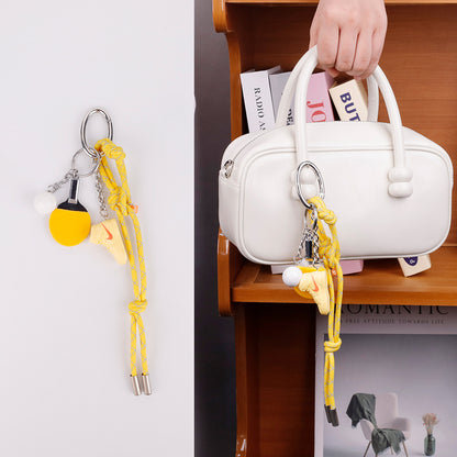 Yellow handmade bag pendant used as a stylish key clip for house keys