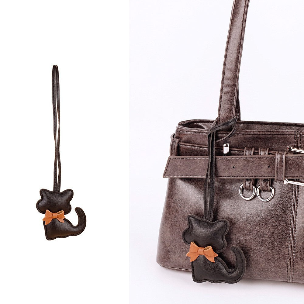Cat bag ornament for adding character to a tote