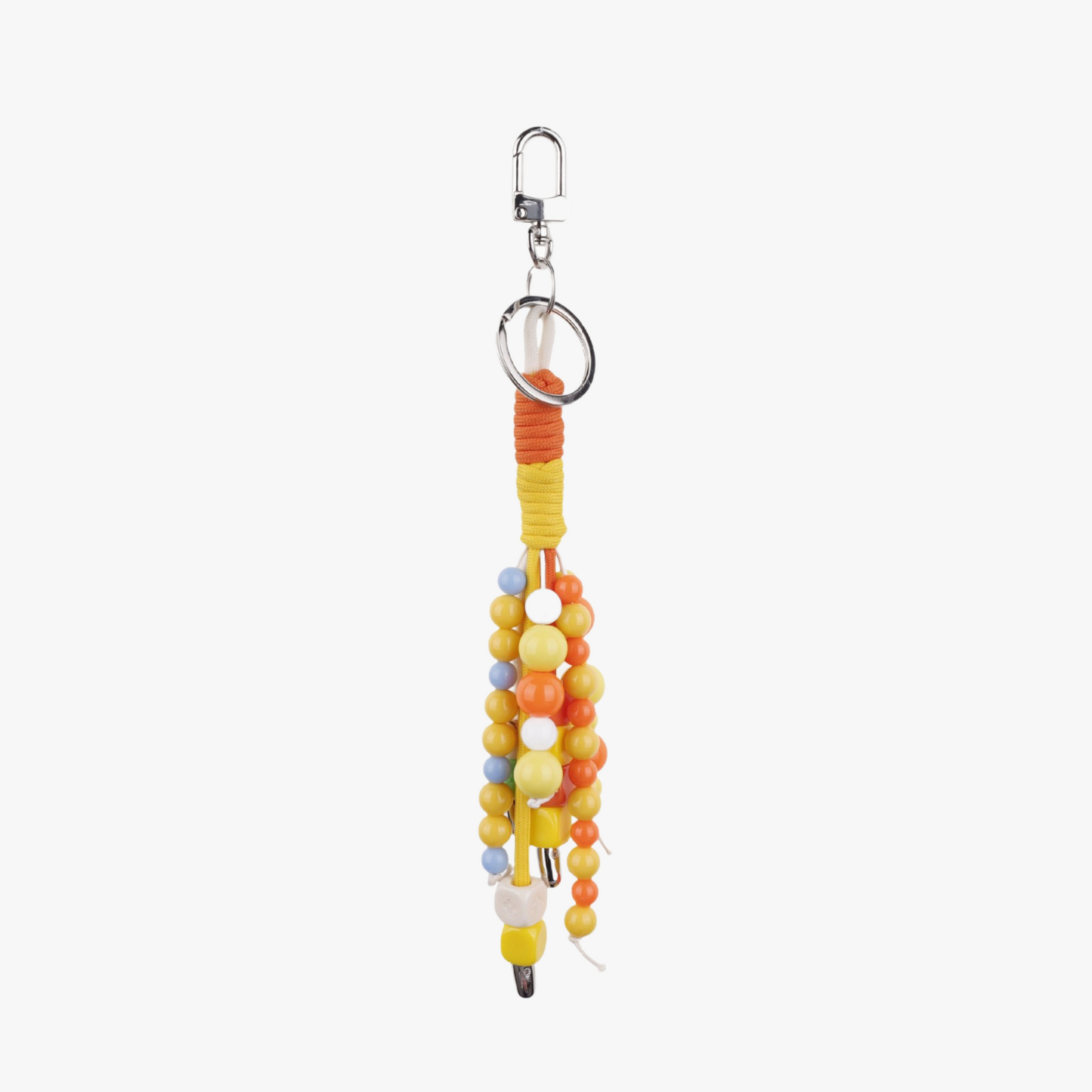 Orange stone beads hanging beside a neutral tote