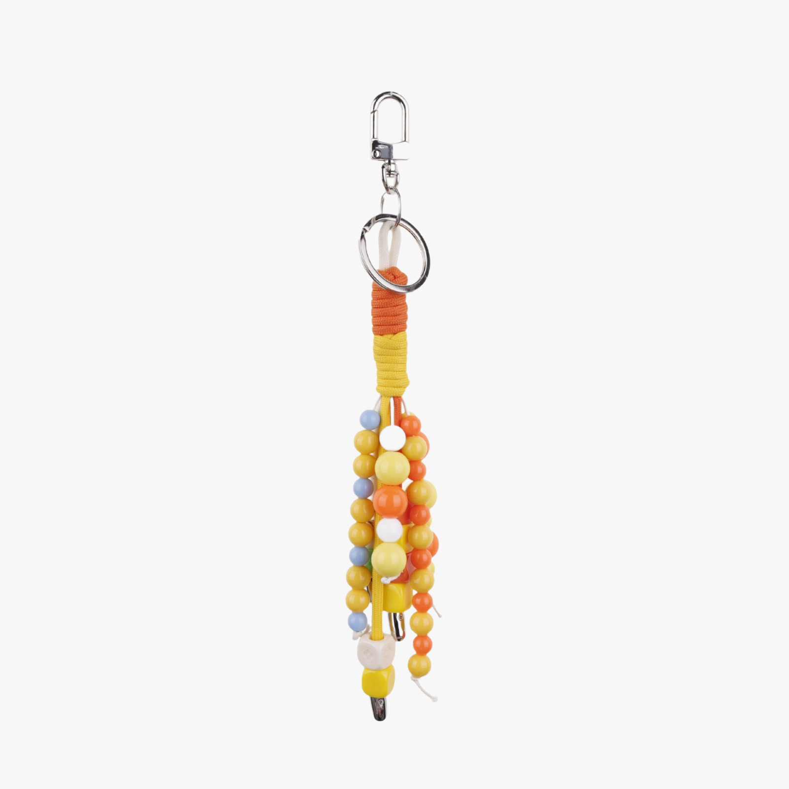 Orange stone beads hanging beside a neutral tote