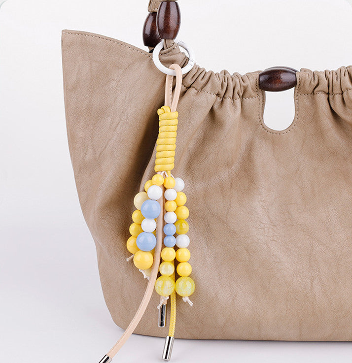Warm orange tones paired with an everyday purse