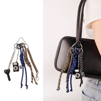Practical-looking bag charm with a playful tassel finish