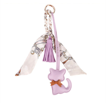 Decorative cat charm for a casual tote bag