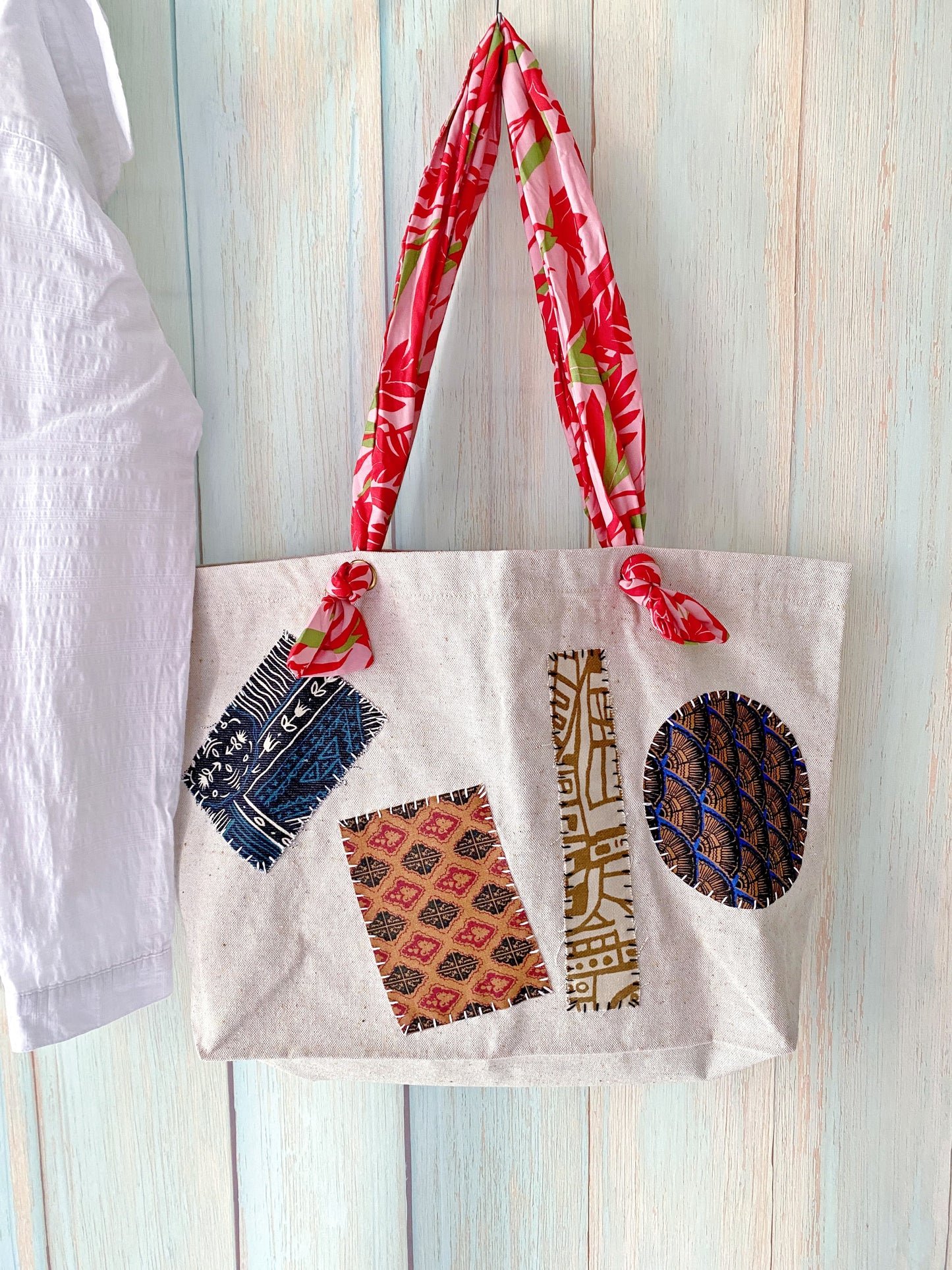 Hand-stitched patchwork canvas tote wrapped as a thoughtful housewarming present