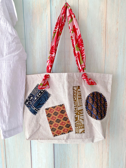 Hand-stitched patchwork canvas tote wrapped as a thoughtful housewarming present