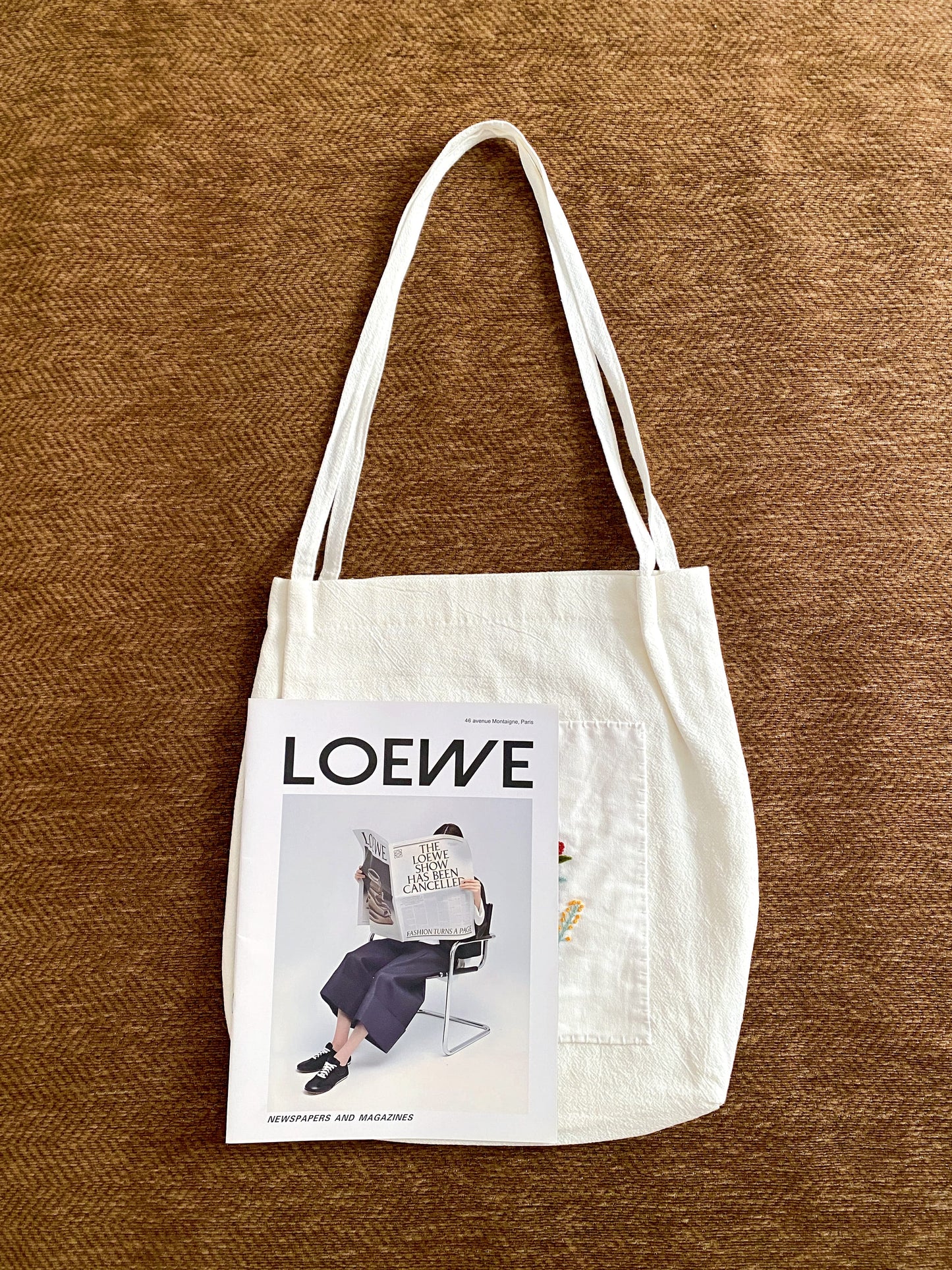 Floral embroidered canvas bag selected for a minimalist who appreciates sustainable fashion