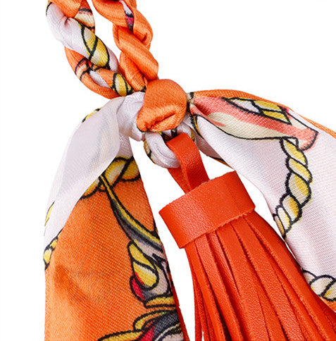 Fox tassel accessory photographed as a close-up bag detail