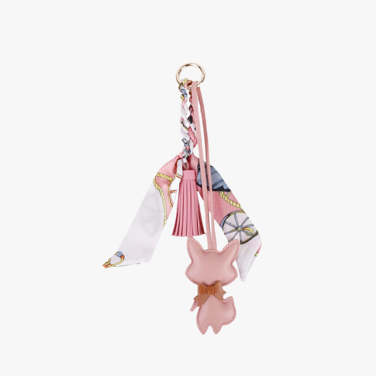 Handmade fox scarf charm shown on a neutral handbag