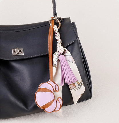 Refined purse decoration with a croissant-inspired design