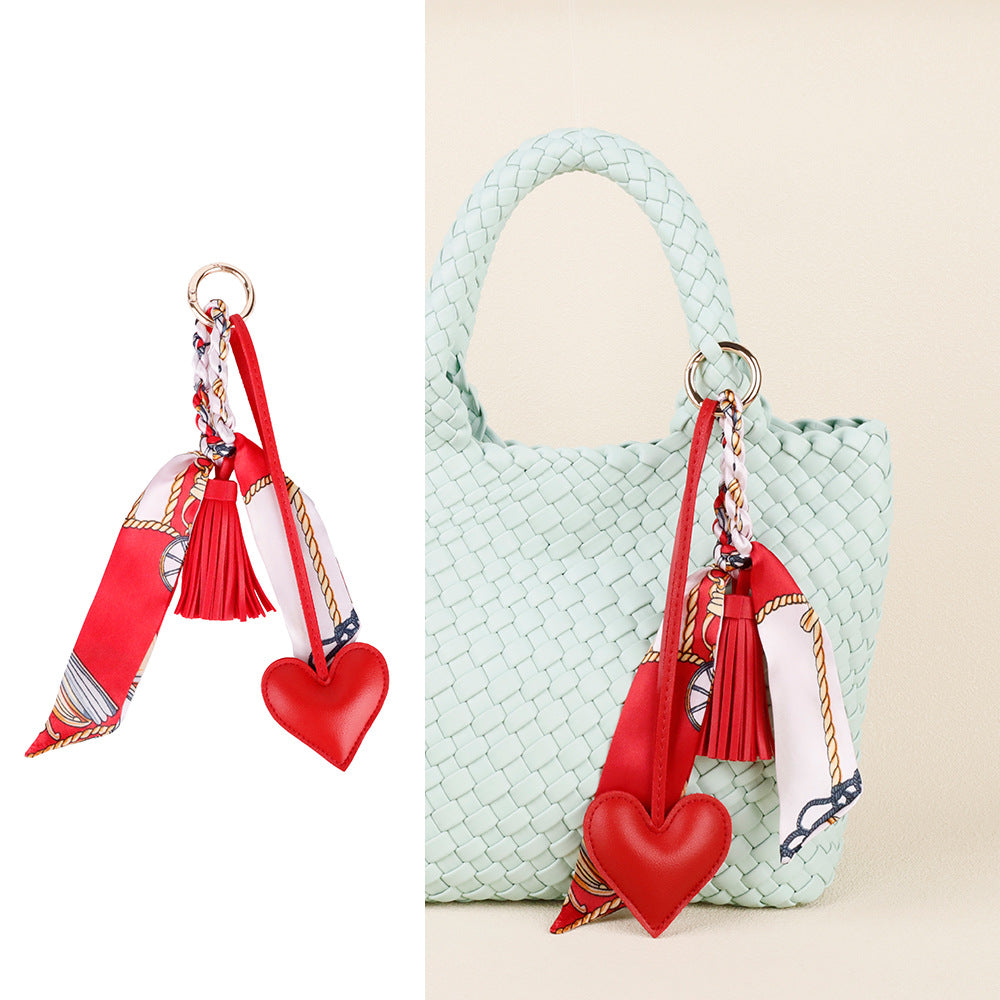 Heart shaped purse accessory with tassel