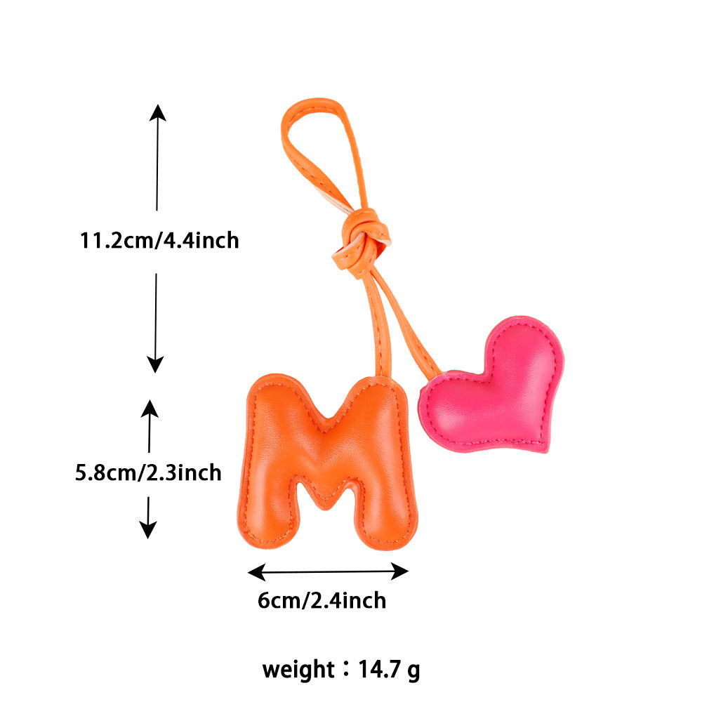 Cute leather heart decoration attached to a purse
