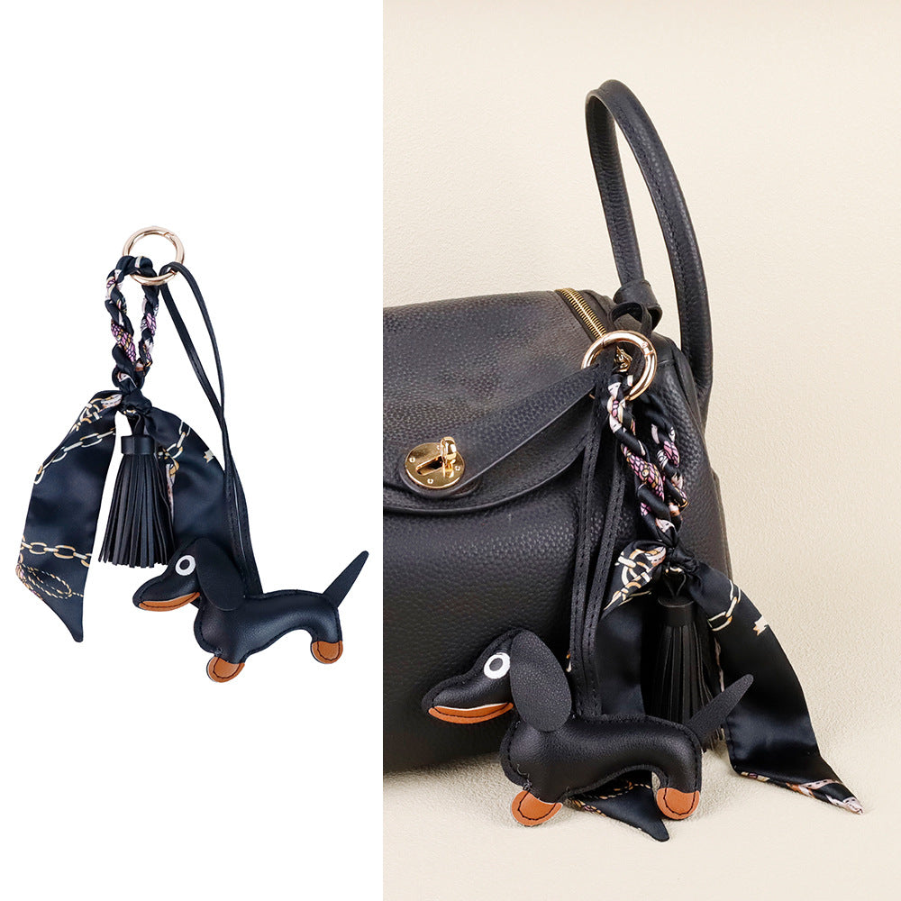 Handmade leather dog charm styled for everyday street purse fashion