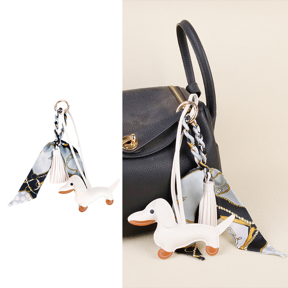 Crafted leather sausage dog charm as a thoughtful birthday gift for friends