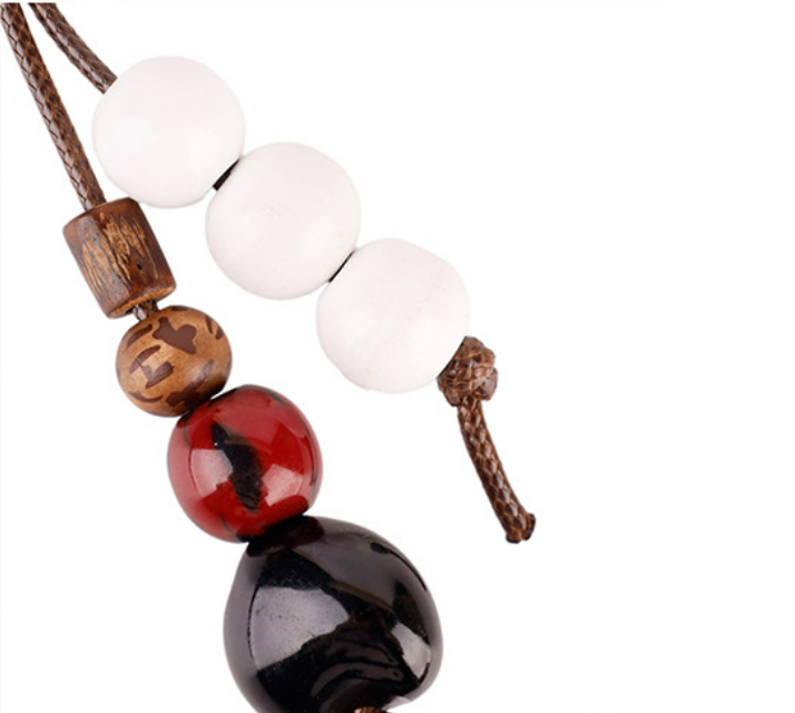 Natural shell charm for adding character to a plain bag