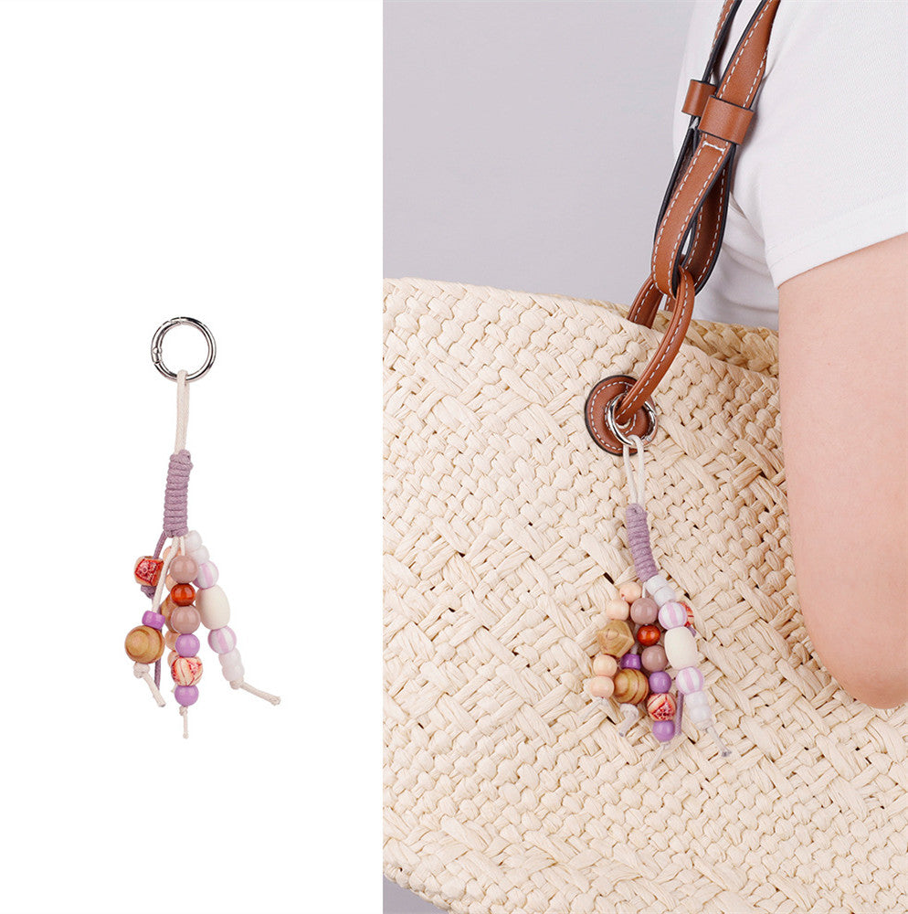 Natural stone and wood bead hanging charm for a relaxed bag look