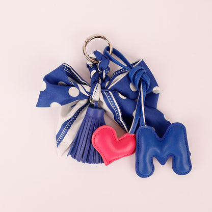 Handmade navy bag charm with scarf detail