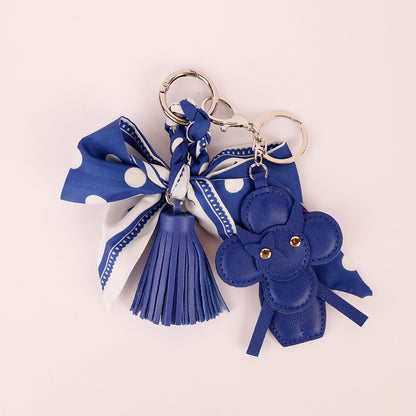 Navy fabric charm with a decorative tassel