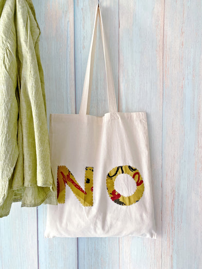 Large cotton tote with hand sewn patchwork design for art supplies