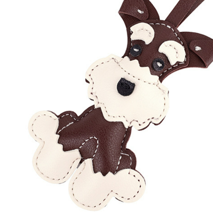 Cheerful dog pendant hanging from an everyday tote