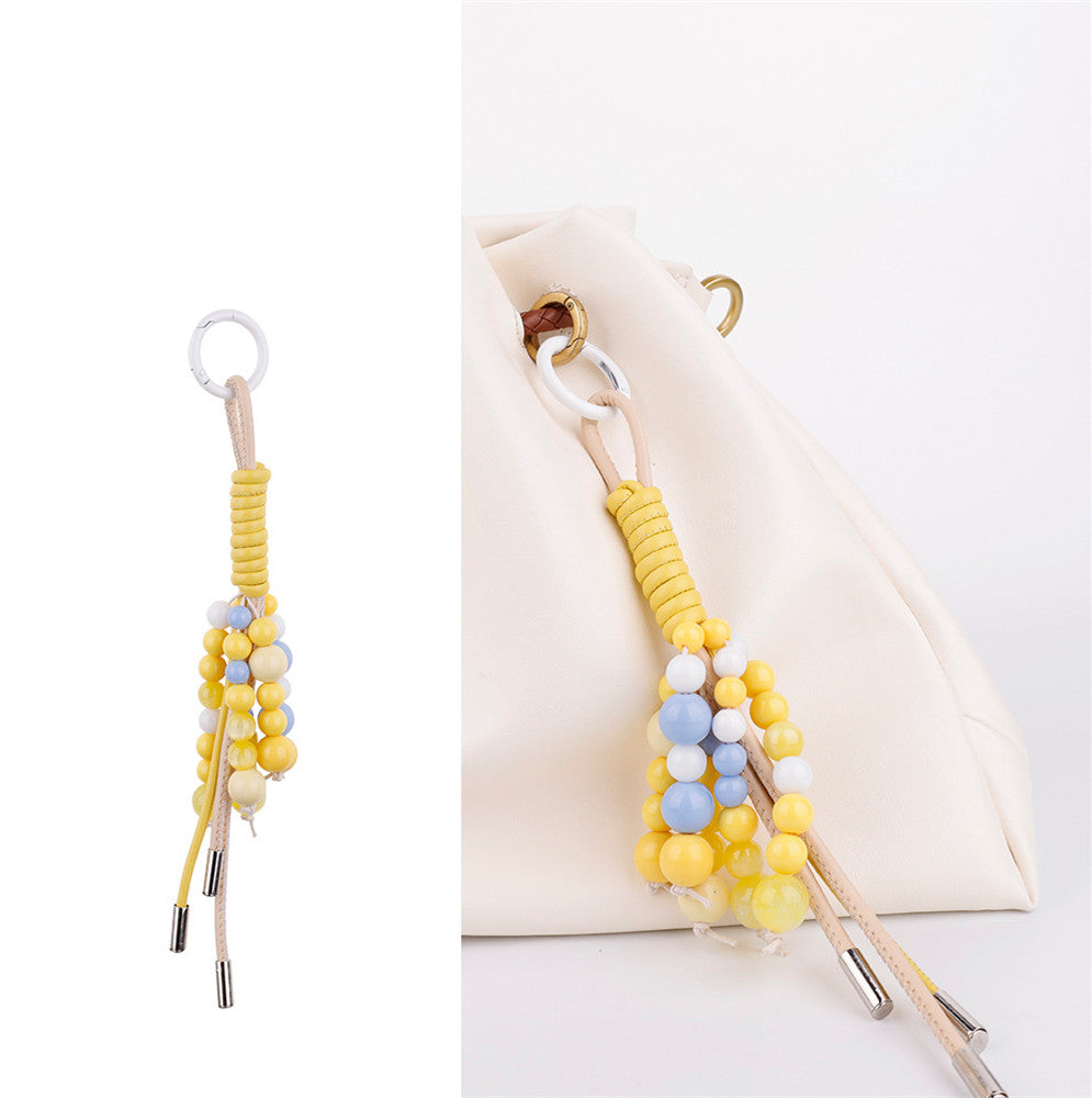 Handcrafted stone ornament paired with a handbag