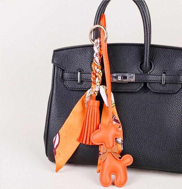Colorful scarf detail paired with a playful giraffe accessory