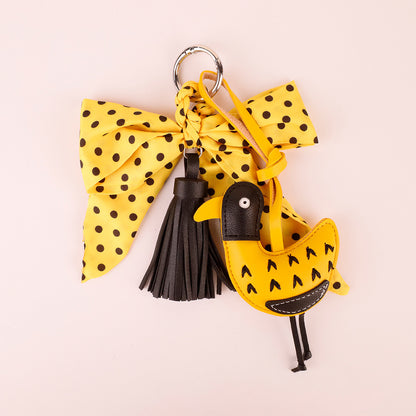 Yellow bow and tassel charm for a handbag