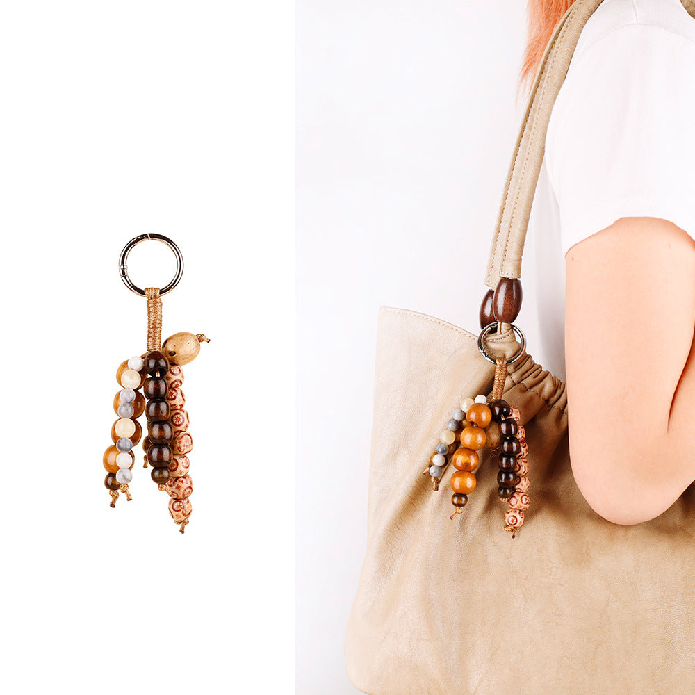 Artisan-inspired bag ornament with wooden beads