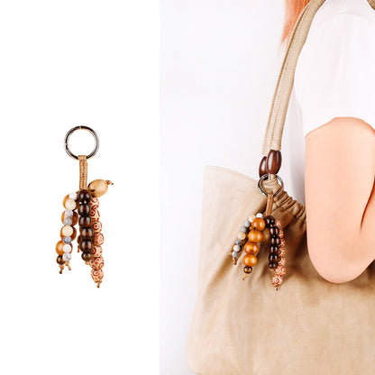 Artisan-inspired bag ornament with wooden beads