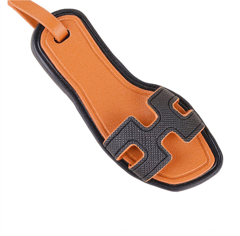Decorative slipper charm for a casual shoulder bag