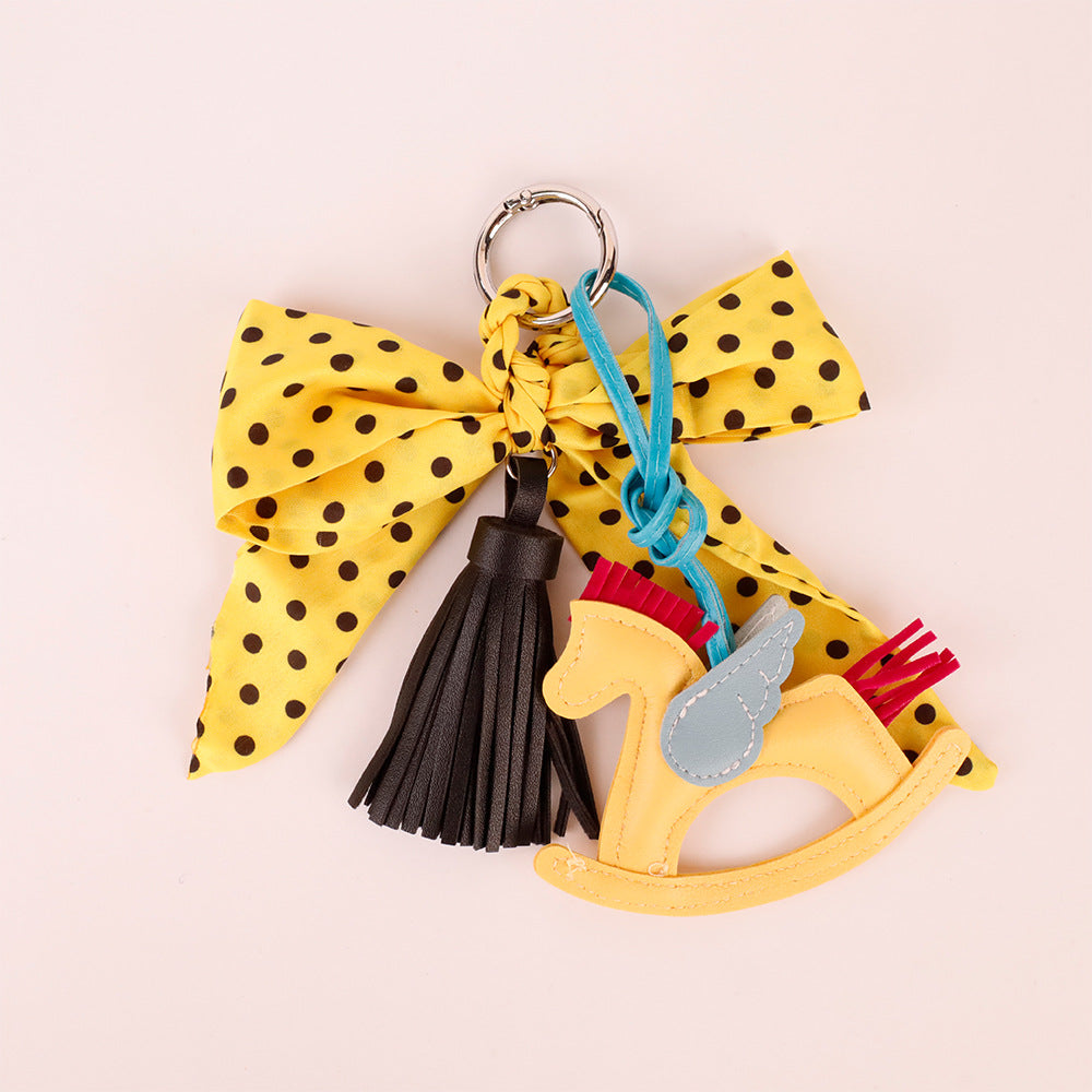 Playful yellow polka dot charm for a handbag
