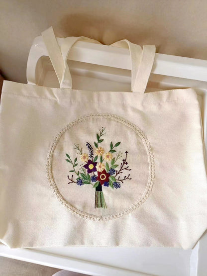 Customizable Handcrafted Canvas Tote Bag with Large Capacity and Detailed Embroidery Design