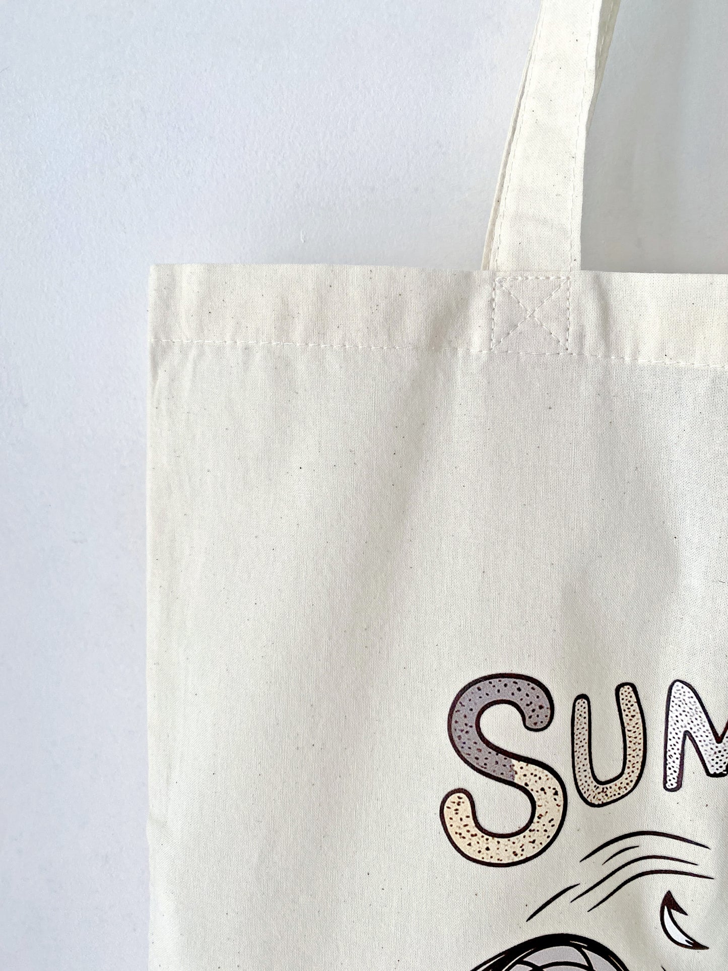 This lightweight, eco-friendly tote bag with a playful kitty print is perfect for running errands or carrying books in style.