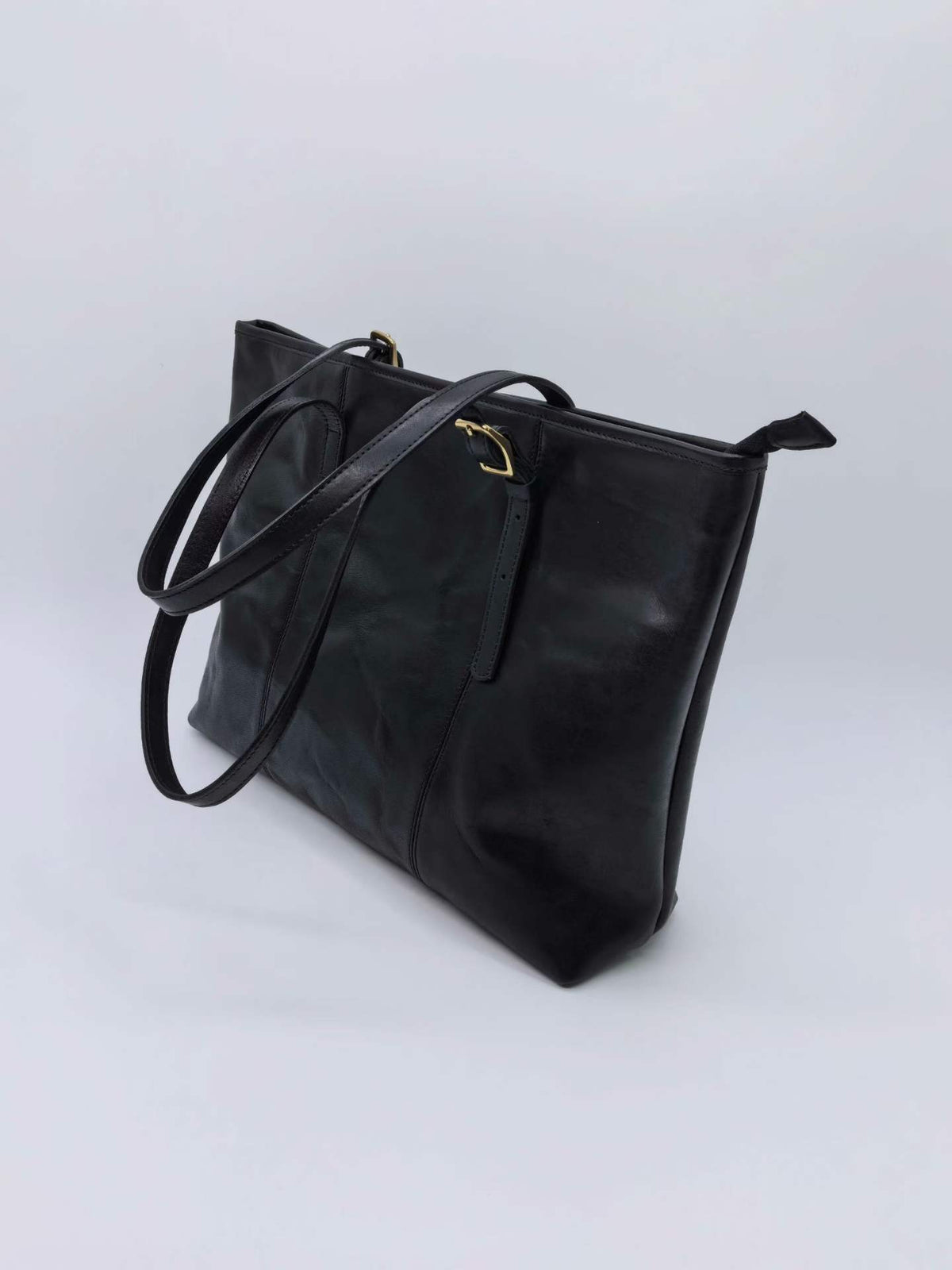 Premium leather work bag with a neat silhouette for carrying documents and personal items.