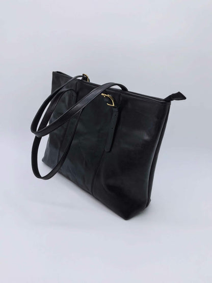 Premium leather work bag with a neat silhouette for carrying documents and personal items.