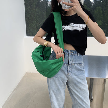 Minimalist crossbody bag with a curved silhouette for casual wear