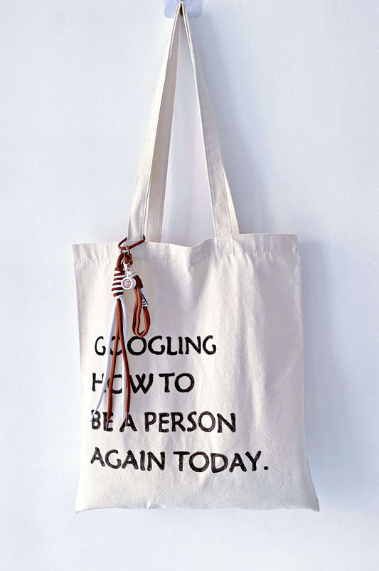 a relaxed everyday bag with handwritten lettering carried on a slow day