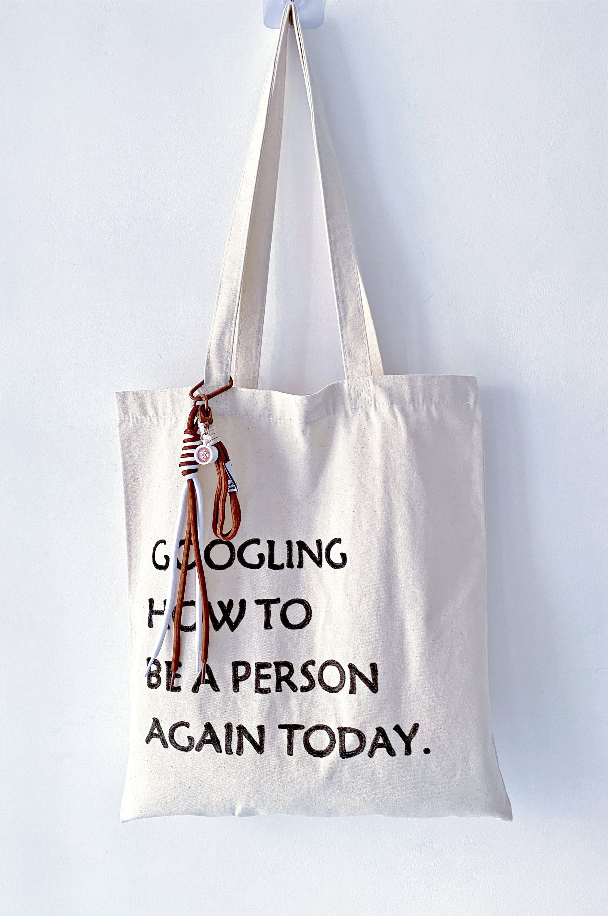 a relaxed everyday bag with handwritten lettering carried on a slow day