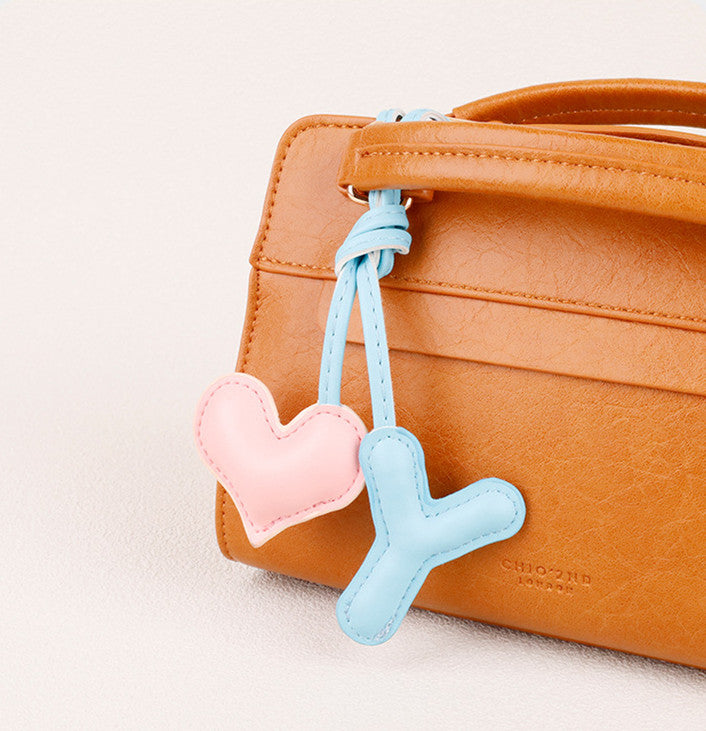 Heart-shaped leather ornament for everyday bags