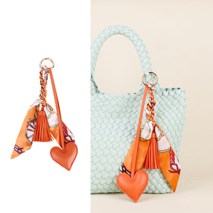 Leather look heart charm with braided scarf