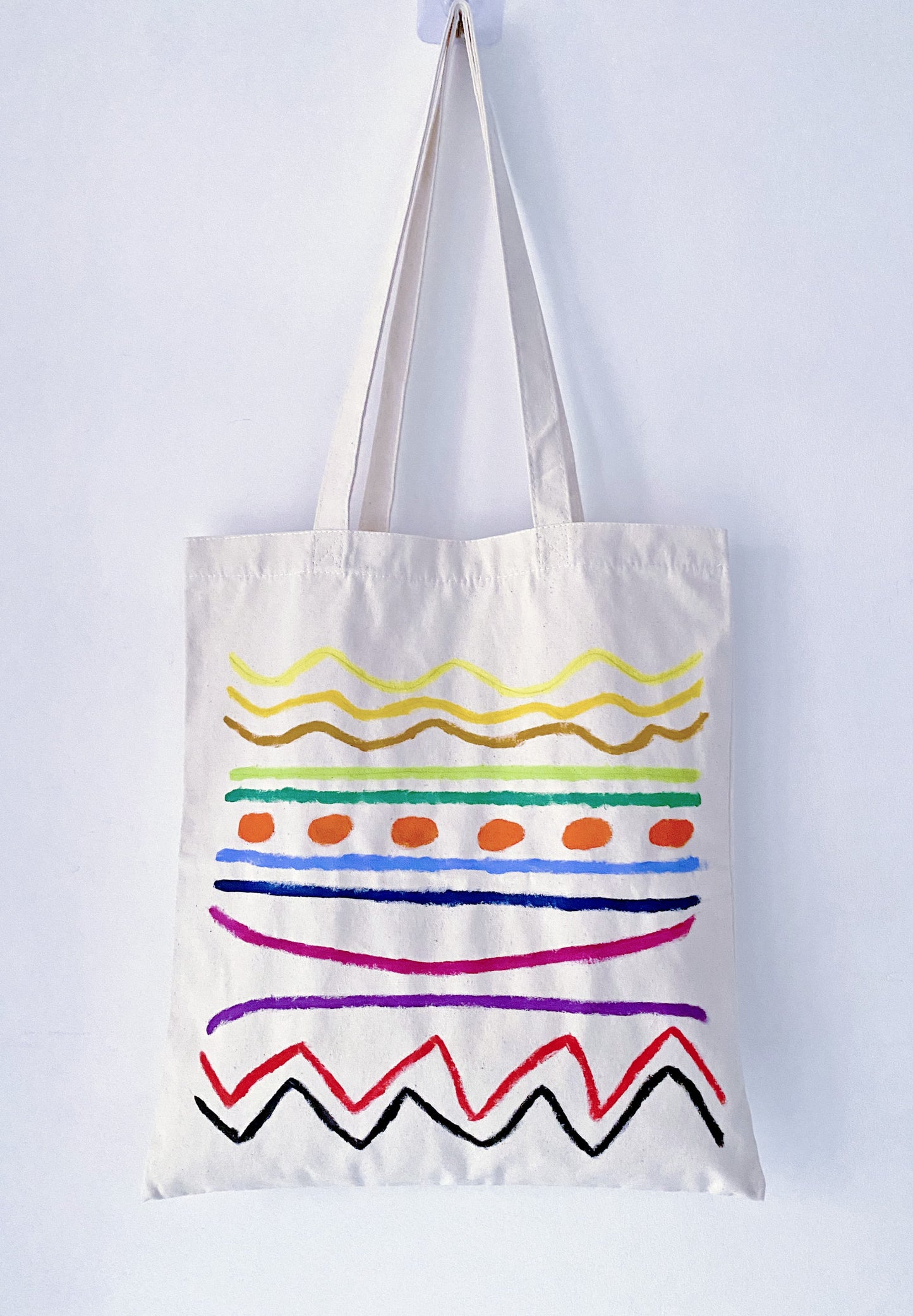 Minimalist aesthetic outfit featuring a spacious hand-painted fabric bag.