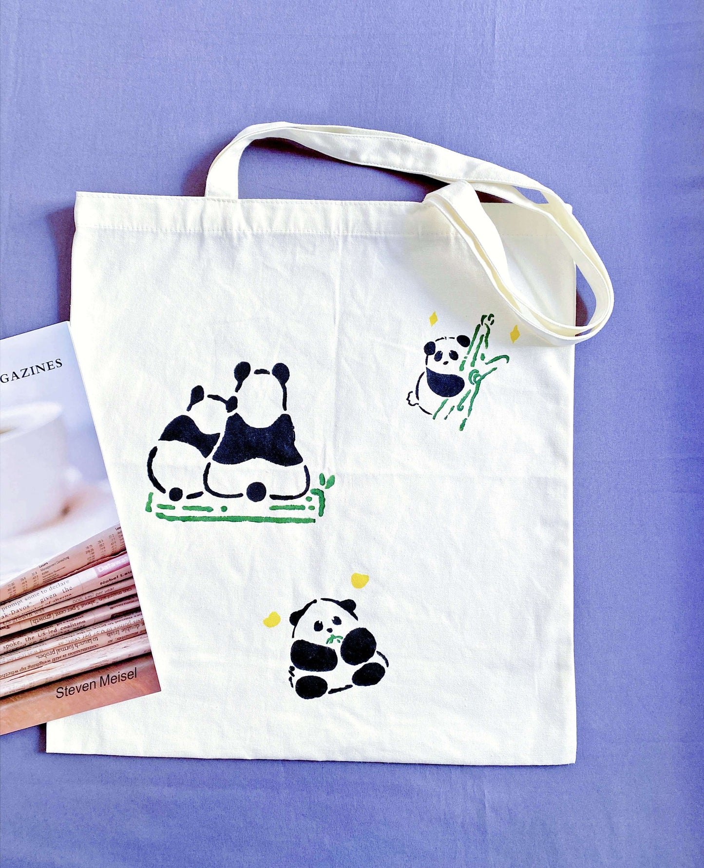 Distinctive alternative to mass-produced fast fashion, hand-detailed panda canvas shopper.