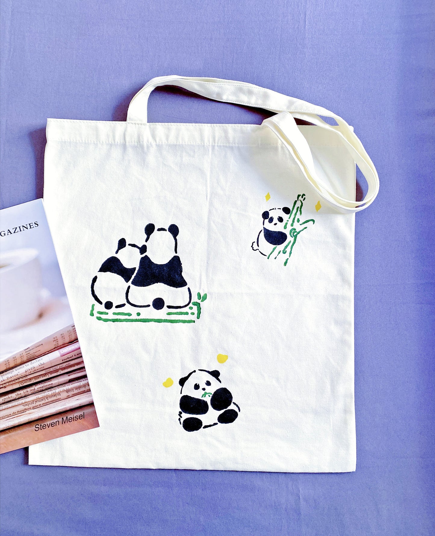 Distinctive alternative to mass-produced fast fashion, hand-detailed panda canvas shopper.