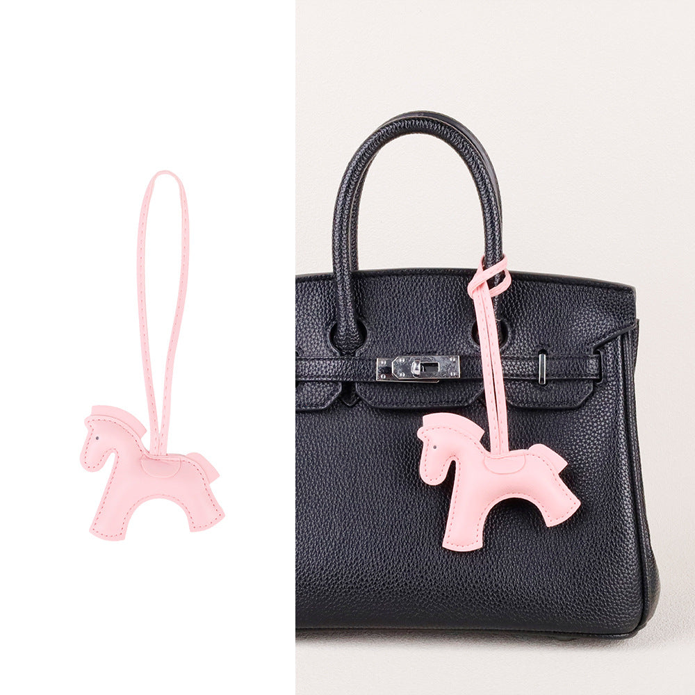 Horse-themed car accessory with a colorful fabric scarf