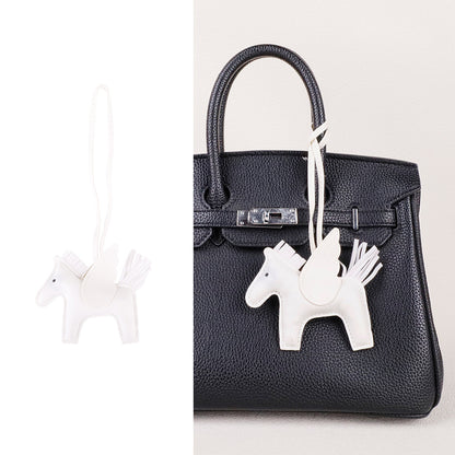 Sophisticated horse charm gift item presented on a neutral fabric background
