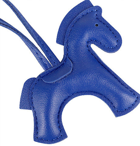 Cartoon horse pendant with a flowing scarf detail