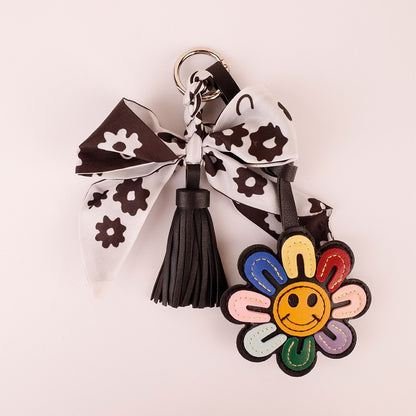 Black and white ribbon purse clip used as a fashion accessory