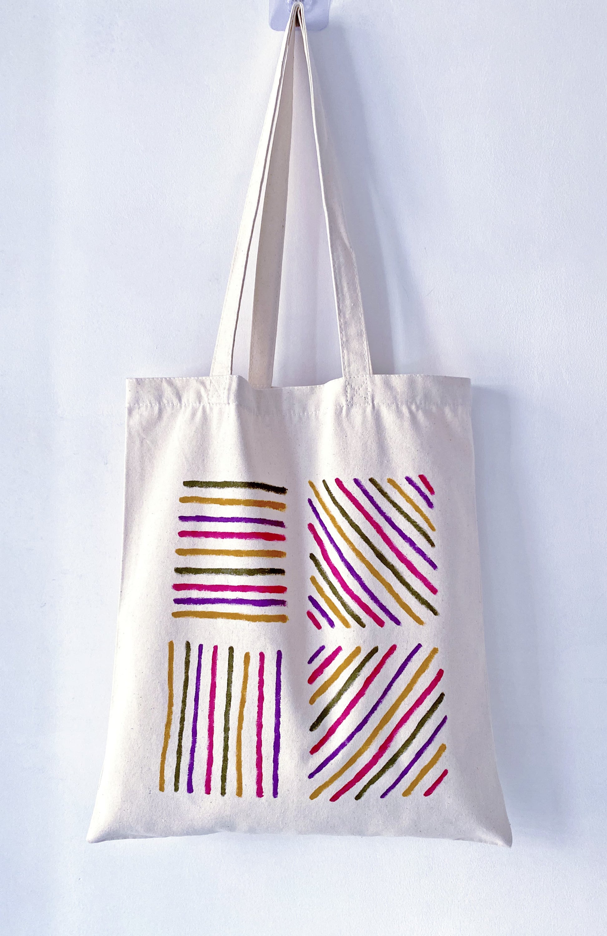 Slouchy canvas bag placed on a park grass during a lazy afternoon.