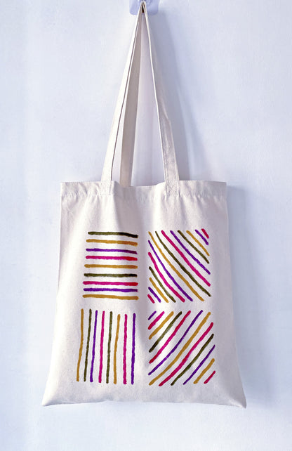 Slouchy canvas bag placed on a park grass during a lazy afternoon.