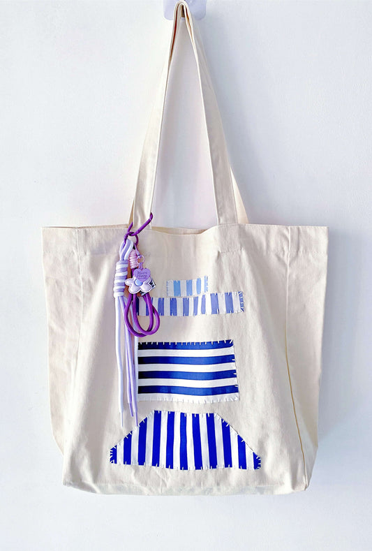 Minimalist patchwork tote reflecting an intentional and slower pace of life.
